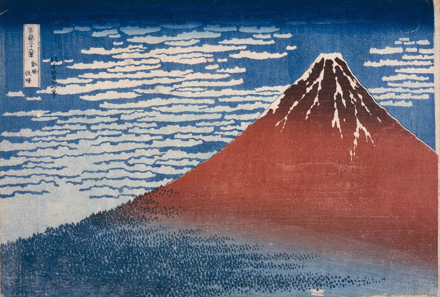 A woodblock print of Mount Fuji in red against a blue sky with rows of white clouds.